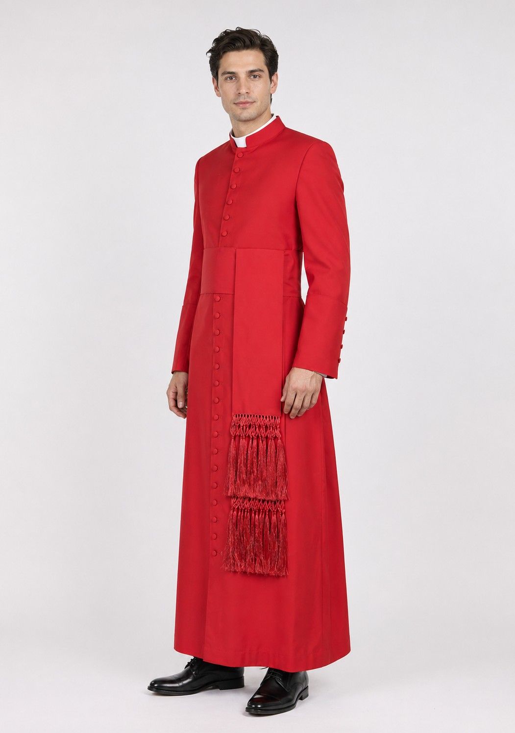 Man wearing a red cassock with a stole on a white background