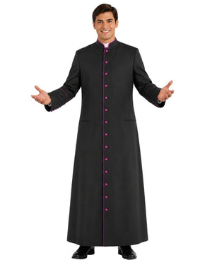 A man modeling a long black clerical cassock with a high collar, front button closure, and magenta button accents, shown against a plain white background.