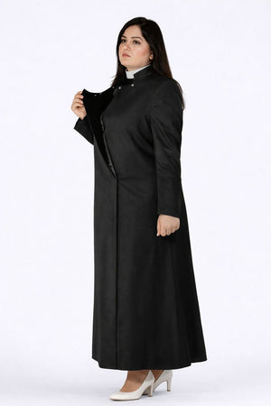 Woman wearing a long black robe on a white background