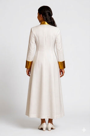 Woman wearing a long white robe with gold accents on a white background