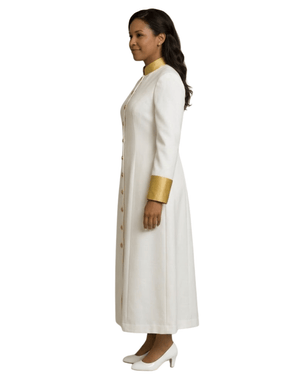 Woman wearing a long white robe with gold accents on a white background.