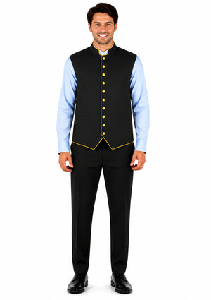 Man wearing a black vest with yellow trim over a light blue shirt on a white background