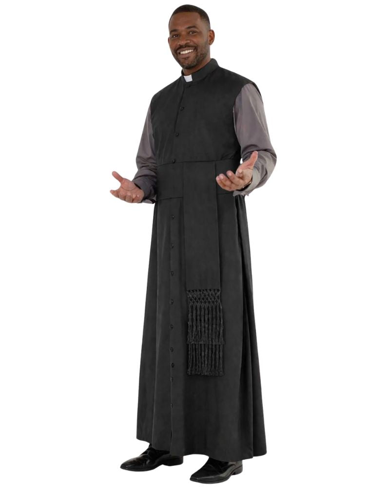 A man modeling a black clergy robe with a long front drape, decorative fringe, and a white clerical collar over a gray shirt, set against a plain white background.