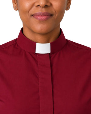 Close-up of a woman wearing a burgundy clerical shirt with a white collar, showing the neck, lower face, and upper chest against a white background.