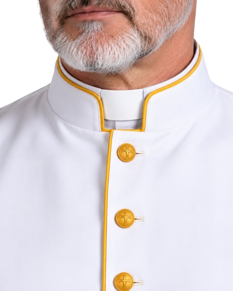 A close-up of a man wearing a Caleb White Clergy Robe With Gold Accents and a gold button-front shirt against a plain white background.