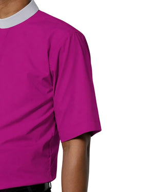 Close-up of a man wearing a Purple shirt with a white collar on a light gray background