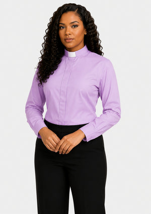 Woman wearing a light purple shirt and black pants on a plain background