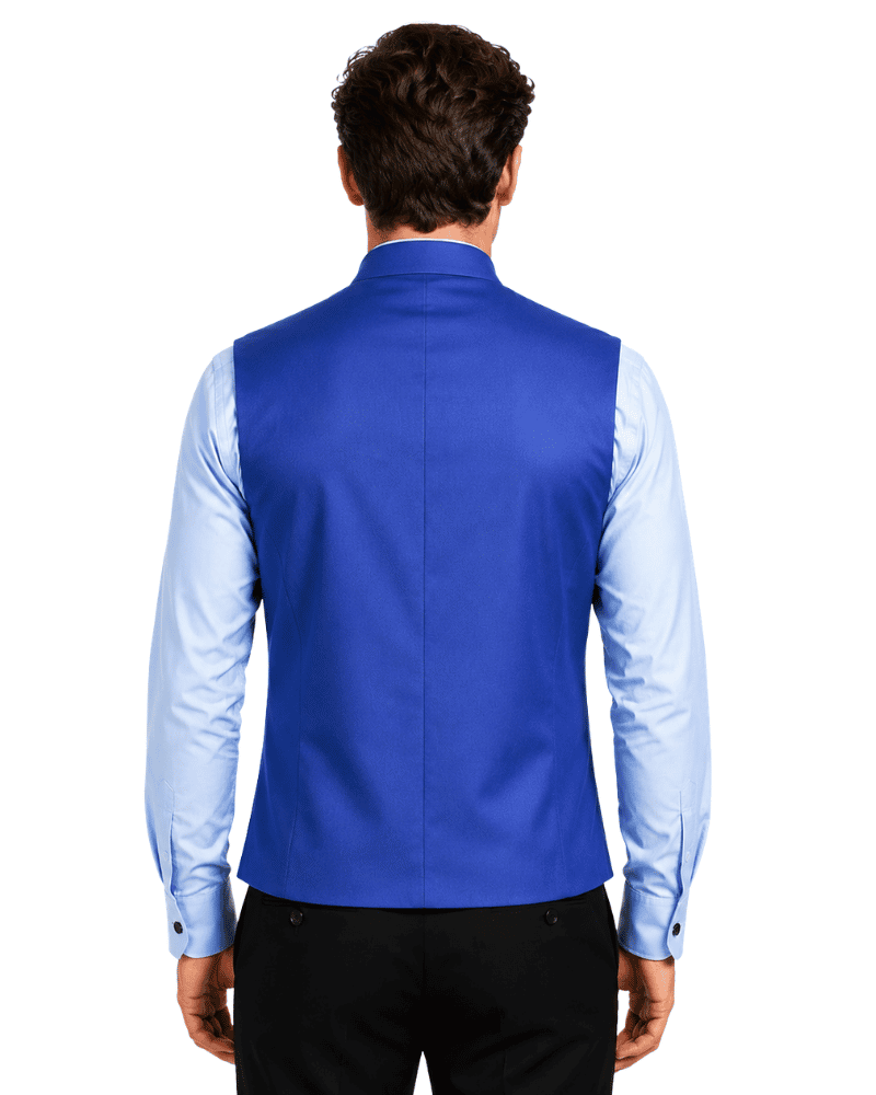 A man viewed from the back wearing a royal blue waistcoat over a light blue dress shirt set against a white background.