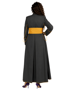 A woman shown from the back wearing a long dark gray cassock with a wide mustard yellow waist sash and thin yellow piping details, set against a plain white background.