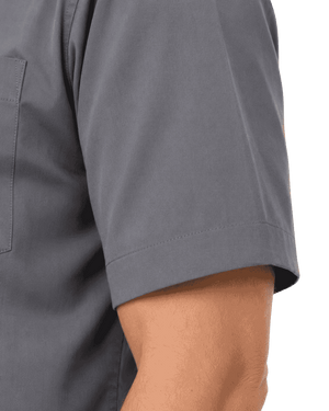 Close-up of a person wearing a short-sleeve gray clerical shirt, showing the sleeve cuff and part of the torso against a plain white background.