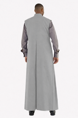 Man wearing a long gray robe with a white background
