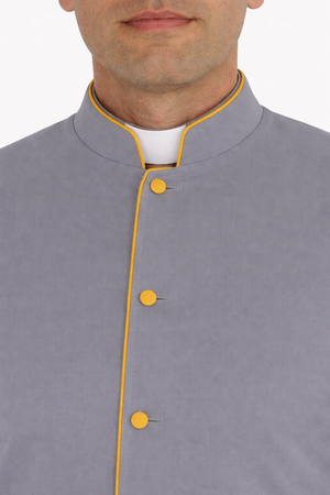 Close-up of a gray robe with yellow buttons on a white background