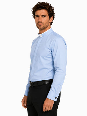 Man wearing a light blue long-sleeve shirt with a collar on a white background