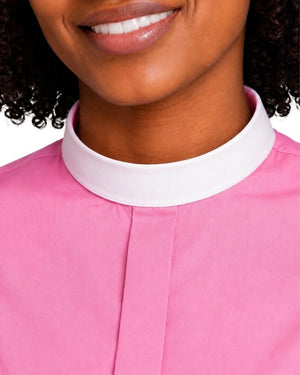 Close-up of a woman wearing a pink clerical shirt with a contrasting white high collar, cropped from the mouth to the chest against a plain white background.