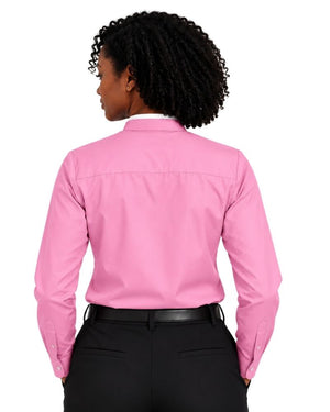 A woman shown from the back wearing a bright pink long-sleeve clerical shirt tucked into black pants, against a plain white background.