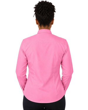 A woman viewed from the back wearing a bright pink long-sleeve clerical shirt and black pants, set against a plain white background.