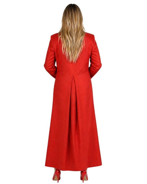 A woman viewed from the back wearing a long red cassock with long sleeves and a high waist, paired with red heels, against a plain white background.
