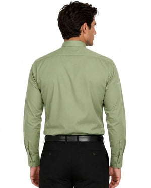 A man viewed from the back wearing a sage green long-sleeve clerical shirt and black trousers, against a plain white background.
