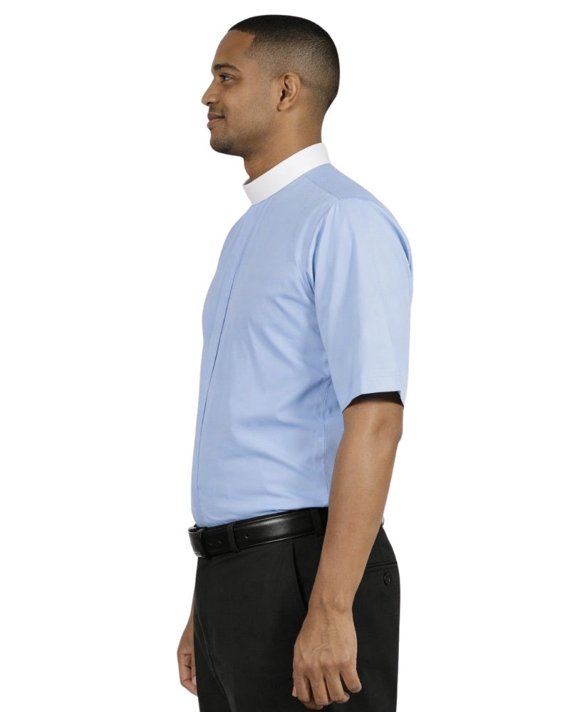 Man wearing a light blue shirt with a white collar and black pants on a white background