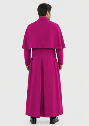 Man wearing a bright pink outfit with a long robe on a white background