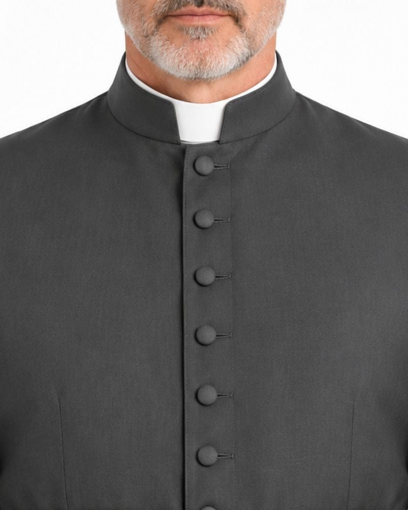 A closeup of the Classic Black Clerical Cassock from neck against plain white background.