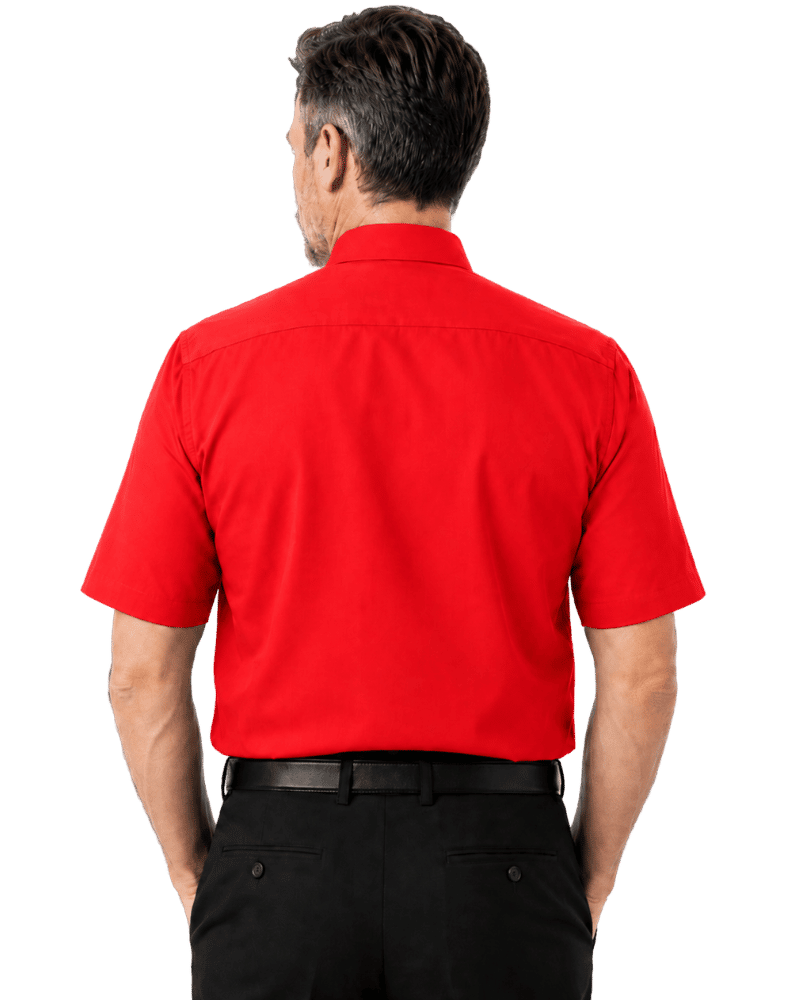 A man viewed from the back wearing a bright red short-sleeve clerical shirt and black trousers, isolated on a solid black background.