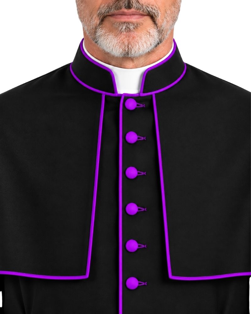 A close-up of a man wearing a black clerical cape or collar with bright purple trim and matching purple buttons, over a white collar, against a plain white background.