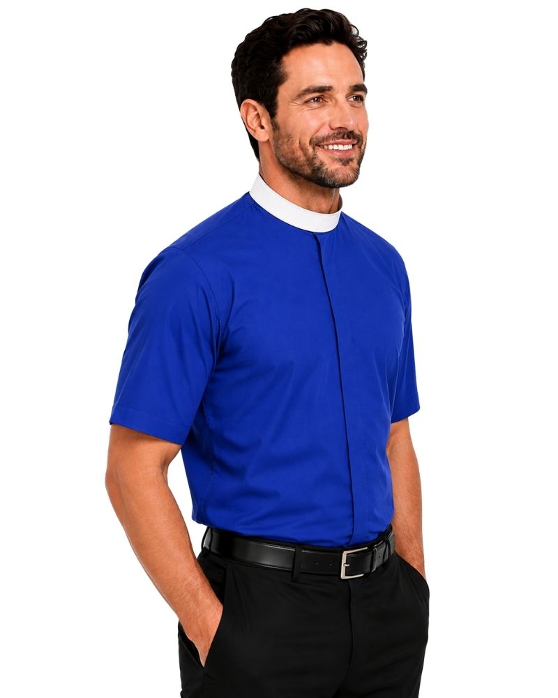 A man wearing a royal blue short-sleeve clerical shirt with a white collar, paired with black trousers and a black belt, photographed against a solid white background.