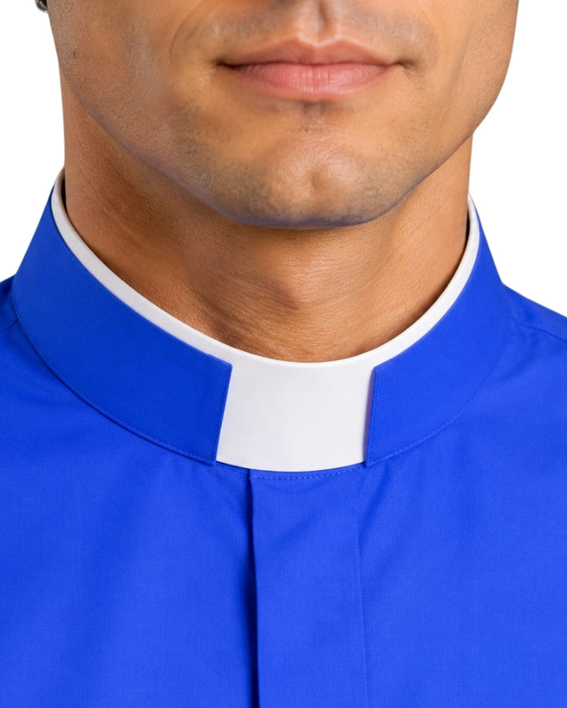 Man wearing a blue clerical shirt with a white collar against a white background