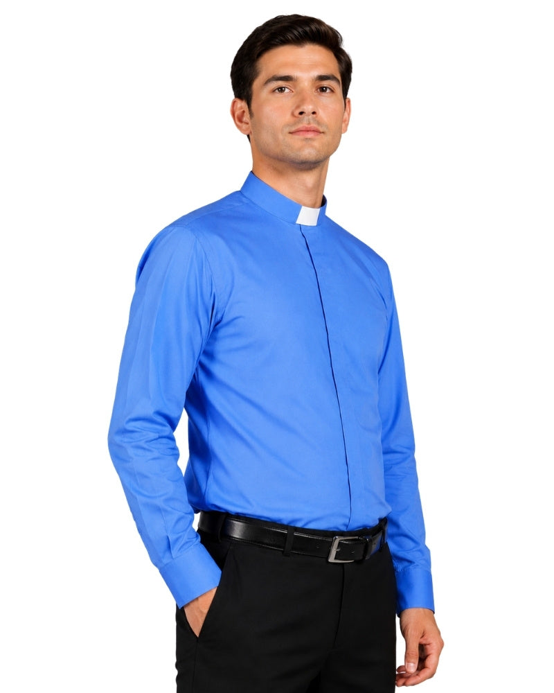 Man wearing a blue clerical shirt with a white collar against a white background