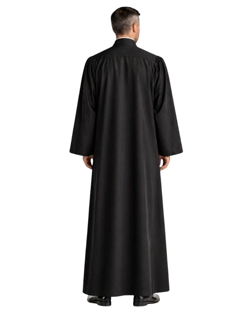 A man viewed from the back wearing a long black robe with wide sleeves, standing against a plain white background.