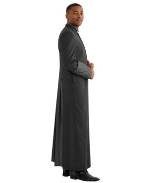 A man wearing a long black clerical robe with a high collar, shown in profile against a plain white background.