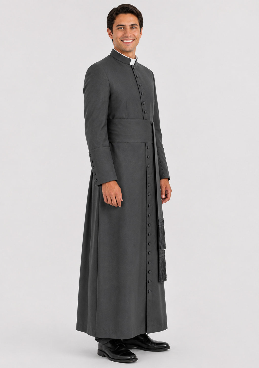 Man wearing a gray priest's robe on a light gray background