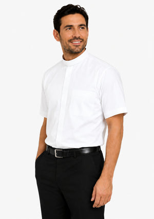 Man wearing a white clerical shirt and black pants on a white background