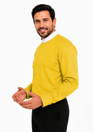 Man wearing a yellow clerical shirt over a white shirt on a white background