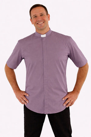 Man wearing a gray clerical shirt with a white background