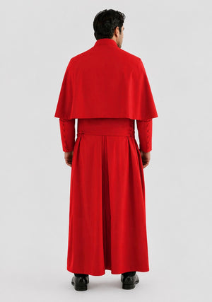 Man wearing a red outfit with a cape on a white background