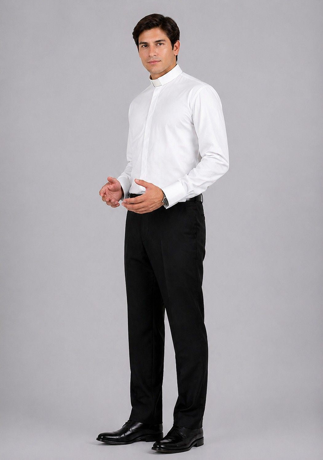 Man wearing a white dress shirt and black pants on a gray background