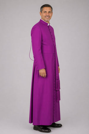 Man wearing a purple robe on a gray background