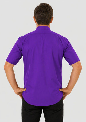 Man wearing a purple shirt against a white background