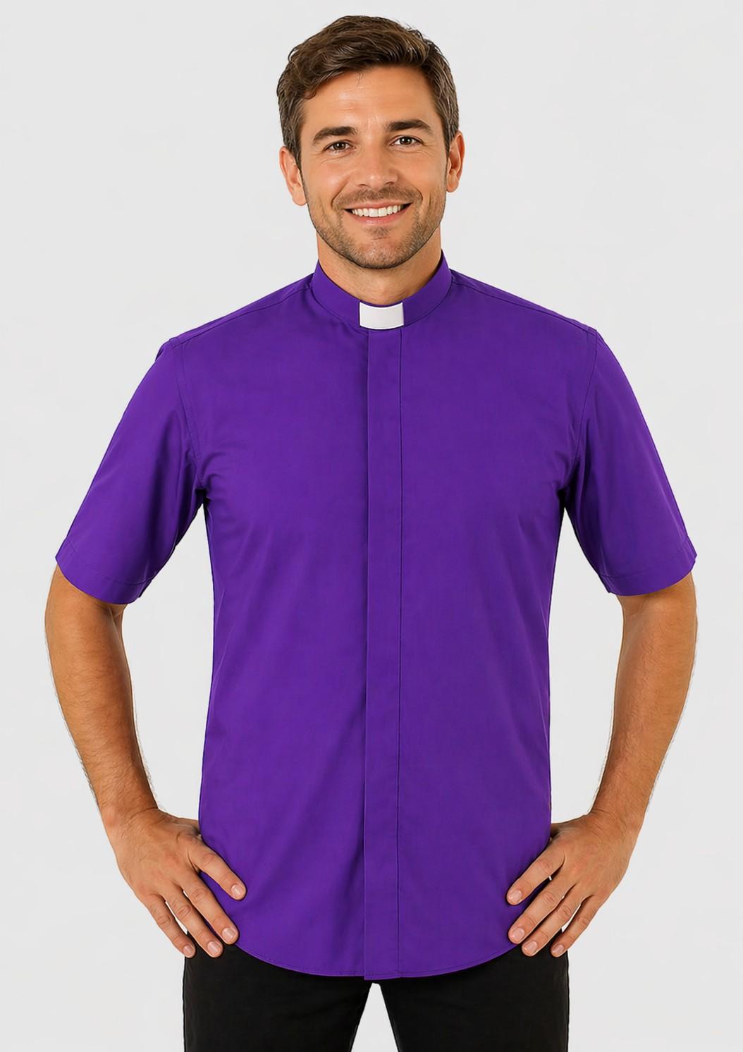 Man wearing a purple clerical shirt with a white collar on a plain background