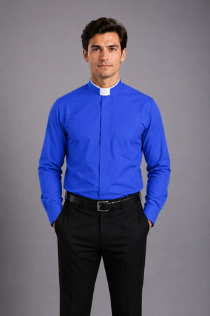 Man wearing a blue clerical shirt with a white collar against a gray background