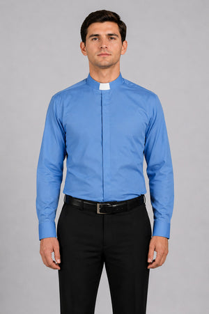 Man wearing a blue clerical shirt with a white collar against a gray background