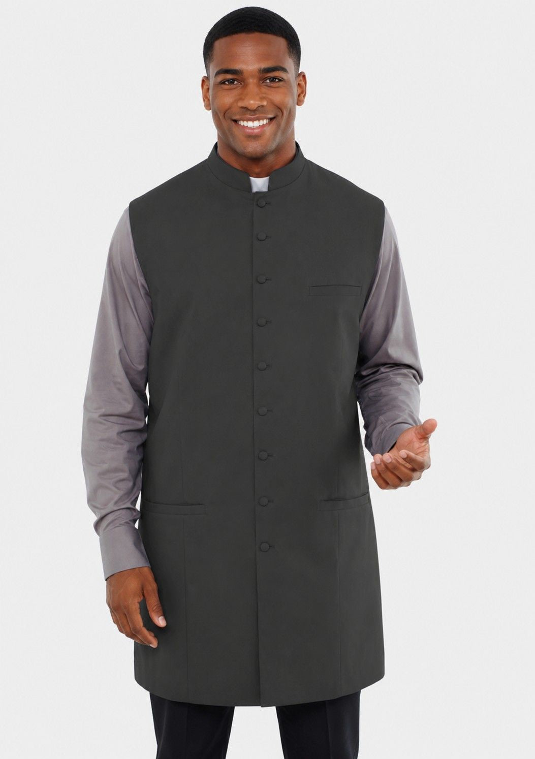 Man wearing a gray long coat over a shirt with a white background