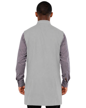 Man wearing a gray vest over a shirt on a white background