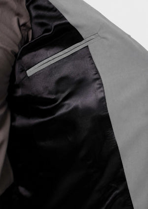 Close-up of a jacket with a detail on a neutral background