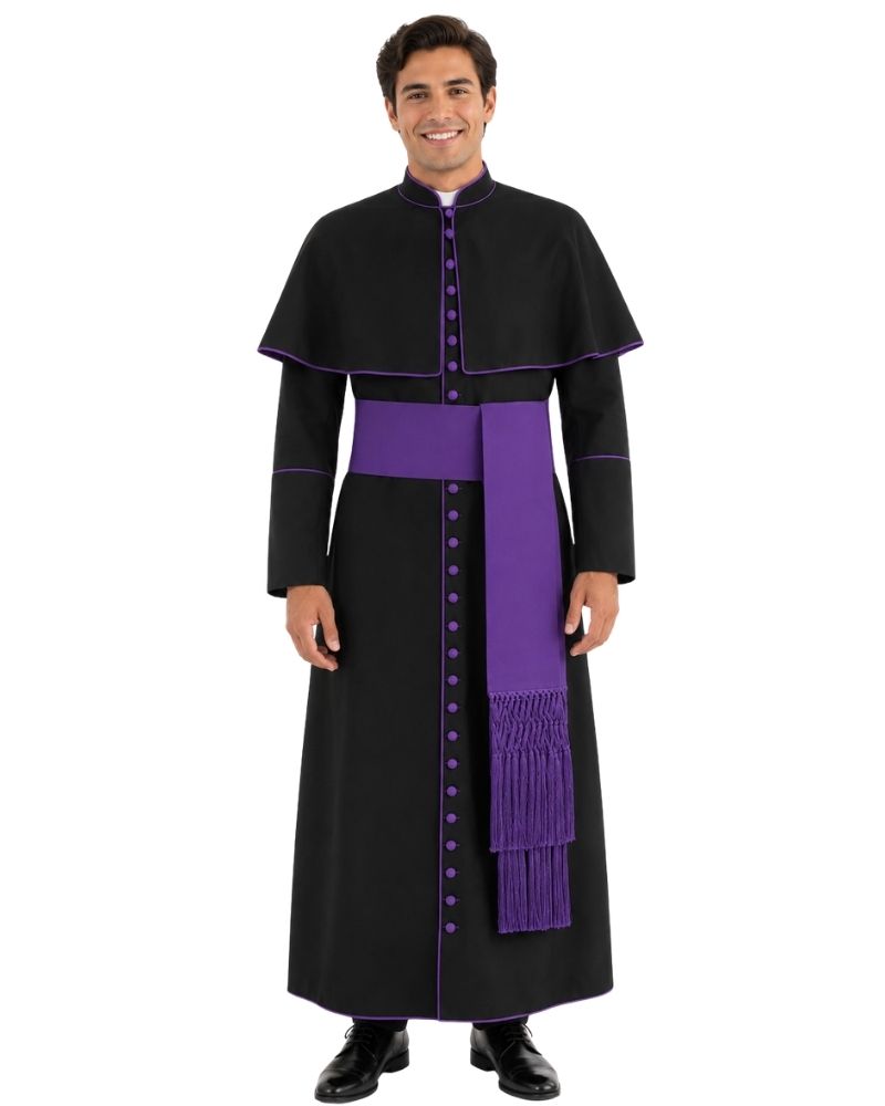 A man modeling a black and purple priest costume consisting of a long black robe with purple trim, a matching purple waist sash, and a purple stole with fringe.