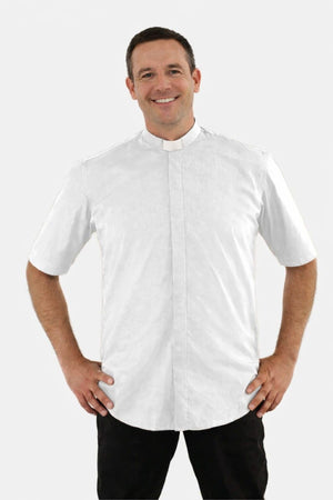 Man wearing a white short-sleeve shirt with a collar on a white background