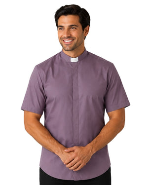 Man wearing a gray clerical shirt with a white collar on a white background