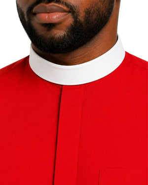 Close-up of a man wearing a bright red collared clerical shirt with a contrasting white high stand collar, cropped from the lower face to the chest against a plain white background.